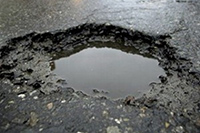 Pothole in rain